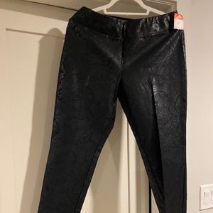 Black patterned pull on pants. Leather look.